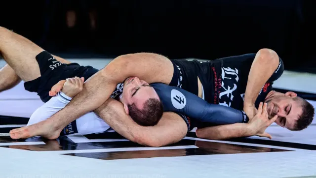 William Tackett demonstrating a grappling technique.