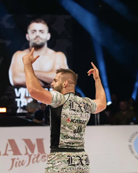 William Tackett acknowledges the crowd after a grappling match.