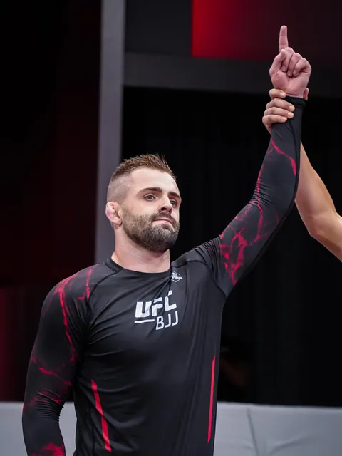 William Tackett’s arm is raised after a UFC BJJ match.